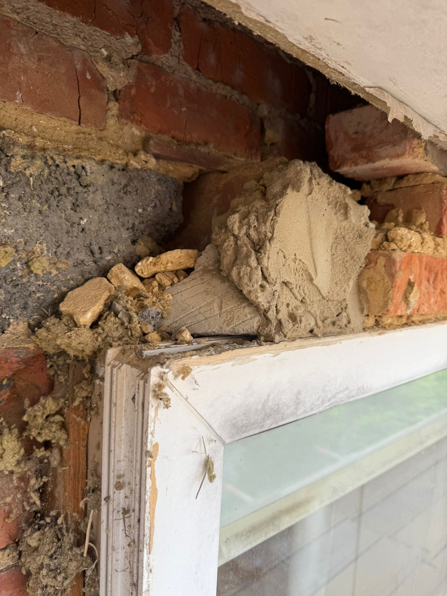 Image shows D & J Plastering completing a dry lining job using tacking